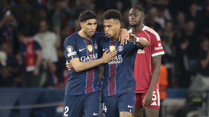 PARIS, FRANCE - APRIL 8: Desire Doue of PSG celebrates his goal with Achraf Hakimi (left) during the UEFA Champions League 2025/26 Quarter-Final First Leg match between Paris Saint-Germain FC and Liverpool FC at Parc des Princes on April 8, 2026 in P
