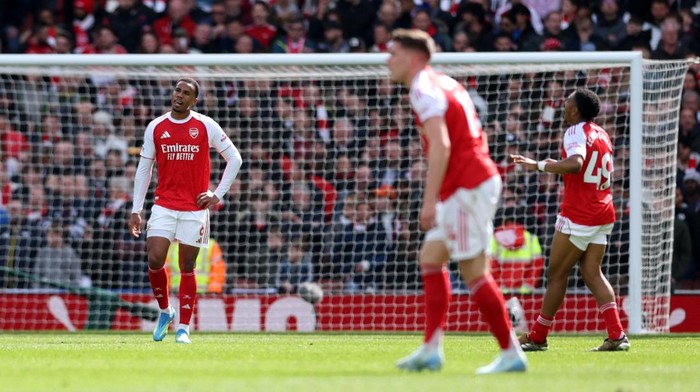 Soccer Football - Premier League - Arsenal v AFC Bournemouth - Emirates Stadium, London, Britain - April 11, 2026 Arsenals Gabriel Magalhaes and Myles Lewis-Skelly look dejected after AFC Bournemouths Alex Scott scores their second goal Action Imag