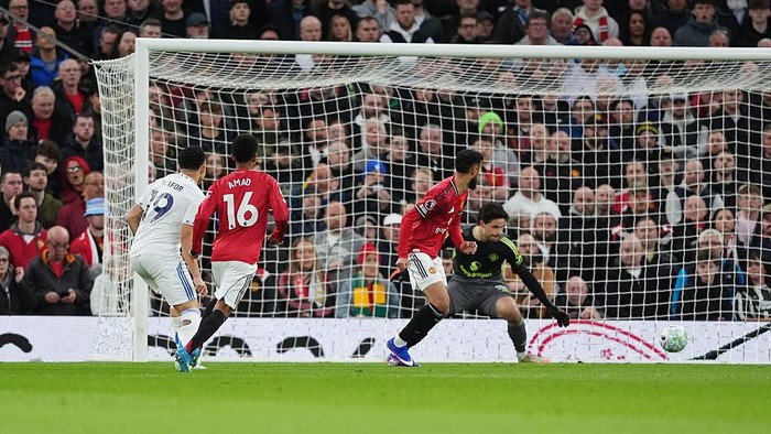 Leeds Uniteds Noah Okafor scores their sides first goal of the game during the Premier League match at Old Trafford, Manchester. Picture date: Monday April 13, 2026. (Photo by Martin Rickett/PA Images via Getty Images)