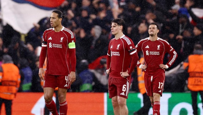 Soccer Football - UEFA Champions League - Quarter Final - Second Leg - Liverpool v Paris St Germain - Anfield, Liverpool, Britain - April 14, 2026 Liverpools Virgil van Dijk and Milos Kerkez look dejected after Paris St Germains Ousmane Dembele sco