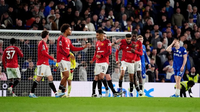 Manchester Uniteds players celebrate at the final whistle after the Premier League match at the Stamford Bridge, London. Picture date: Saturday April 18, 2026. (Photo by John Walton/PA Images via Getty Images)