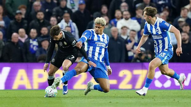 Chelsea's Pedro Neto (left) is tackled by Brighton and Hove Albion's Georginio Rutter during the Premier League match at the American Express Stadium, Brighton. Picture date: Tuesday April 21, 2026. (Photo by Gareth Fuller/PA Images via Getty Images)