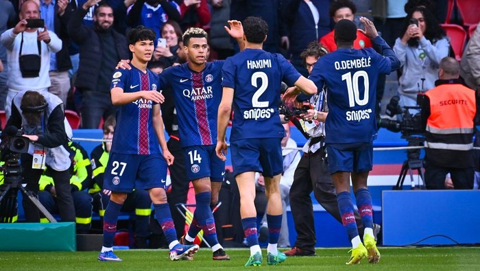 PARIS, FRANCE - APRIL 22: Desire Doue of Paris Saint Germain (C) celebrates with teammates during the Ligue 1 McDonalds match between Paris Saint-Germain FC and FC Nantes at Parc des Princes on April 22, 2026 in Paris, France. (Photo by Federico Pes