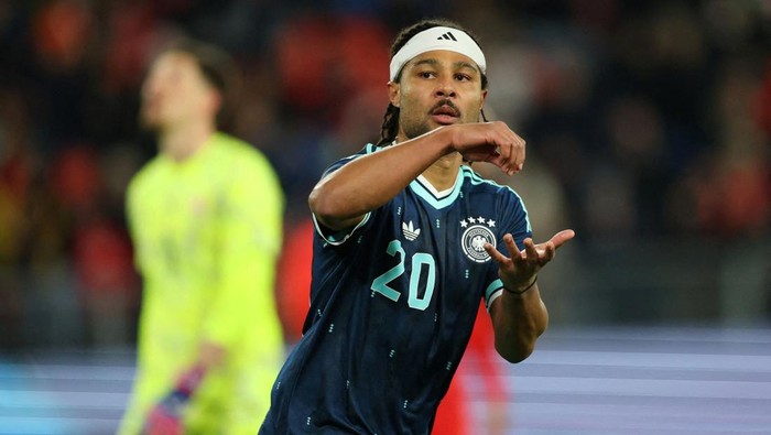 FILE PHOTO: Soccer Football - International Friendly - Switzerland v Germany - St. Jakob-Park, Basel, Switzerland - March 27, 2026 Germanys Serge Gnabry celebrates scoring their second goal REUTERS/Denis Balibouse/File Photo