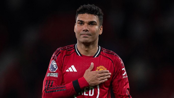 MANCHESTER, ENGLAND - APRIL 27: Casemiro of Manchester United pats his badge after the Premier League match between Manchester United and Brentford at Old Trafford on April 27, 2026 in Manchester, England. (Photo by Visionhaus/Getty Images)