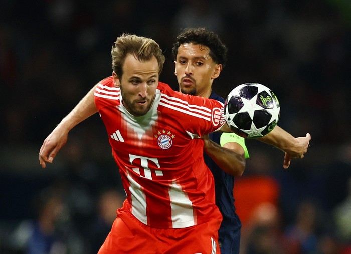 Soccer Football - UEFA Champions League - Semi Final - First Leg - Paris St Germain v Bayern Munich - Parc des Princes, Paris, France - April 28, 2026 Bayern Munichs Harry Kane in action with Paris St Germains Marquinhos REUTERS/Sarah Meyssonnier