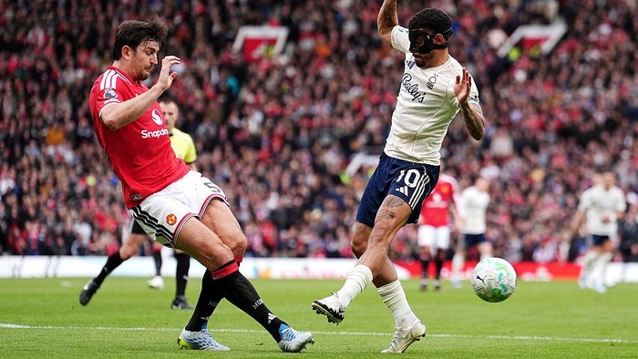 Manchester Uniteds Harry Maguire (left) and Nottingham Forests Morgan Gibbs-White battle for the ball during the Premier League match at Old Trafford, Manchester. Picture date: Sunday May 17, 2026. (Photo by Martin Rickett/PA Images via Getty Image