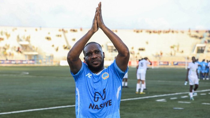 Retired Nigerian football star Jay-Jay Okocha applauds the fans after a FIFA-backed exhibition match between an international team and a local side at the National Stadium in Mogadishu on May 27, 2025. Three African football legends -Samuel Etoo, Em