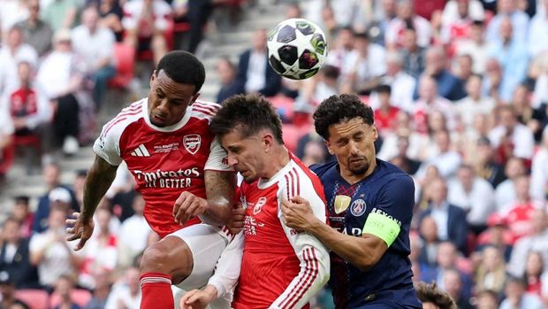 SOCCER-CHAMPIONS-PSG-ARS/ Soccer Football - UEFA Champions League - Final - Paris St Germain v Arsenal - Puskas Arena, Budapest, Hungary - May 30, 2026 Arsenal's Gabriel Magalhaes and Kai Havertz in action with Paris St Germain's Marquinhos REUTERS/Phil Noble