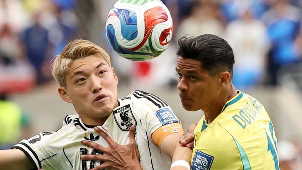 Soccer Football - FIFA World Cup 2026 - Round of 32 - Brazil v Japan - Houston Stadium, Houston, Texas, U.S. - June 29, 2026 Japan's Ritsu Doan in action with Brazil's Douglas Santos IMAGN IMAGES via Reuters/Troy Taormina
