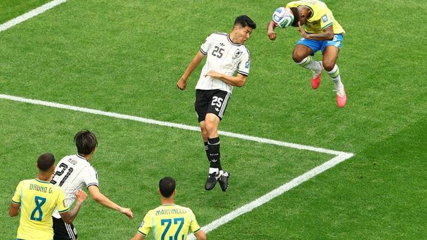 Soccer Football - FIFA World Cup 2026 - Round of 32 - Brazil v Japan - Houston Stadium, Houston, Texas, U.S. - June 29, 2026 Brazil's Douglas Santos in action with Japan's Junnosuke Suzuki REUTERS/Pedro Nunes