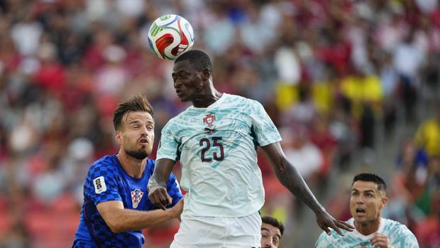 Soccer Football - FIFA World Cup 2026 - Round of 32 - Portugal v Croatia - Toronto Stadium, Toronto, Canada - July 2, 2026 Portugal's Nuno Mendes in action with Croatia's Marin Pongracic IMAGN IMAGES via Reuters/Kevin Sousa