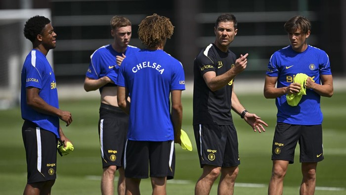 COBHAM, ENGLAND - JULY 9: Ryan kavuma-McQueen, Manager Xabi Alonso and Reggie Walsh of Chelsea during a training session at Chelsea Training Ground on July 9, 2026 in Cobham, United Kingdom. (Photo by Darren Walsh/Chelsea FC via Getty Images)