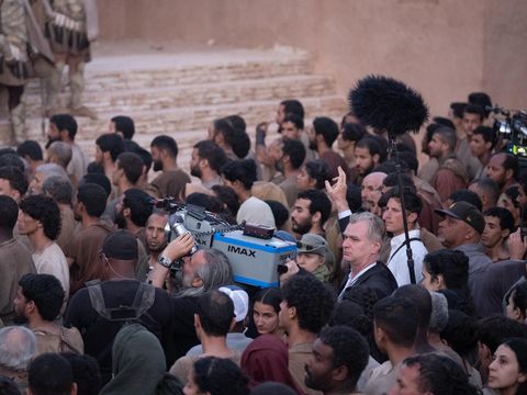 Behind the scenes film The Odyssey (2026) Director Christopher Nolan (center frame, arm raised) on set of his film THE ODYSSEY, written, produced, and directed by Christopher Nolan.
