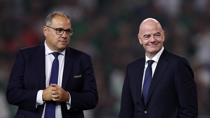 HOUSTON, TEXAS - JULY 06: CONCACAF President Victor Montagliani (L) and FIFA President Gianni Infantino look on during the trophy ceremony after Mexico beat the United States 2-1 to win the CONCACAF Gold Cup 2025 between the United States and Mexico 