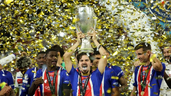 SALZBURG, AUSTRIA - AUGUST 12: Vitinha of Paris Saint-Germain lifts the UEFA Super Cup trophy after his teams victory in the UEFA Super Cup 2026 match between Paris Saint-Germain and Aston Villa at Stadion Salzburg on August 12, 2026 in Salzburg, Au