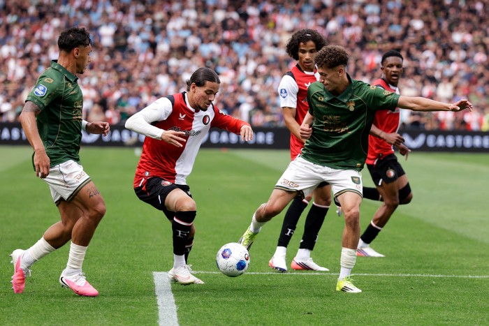 ROTTERDAM, NETHERLANDS - AUGUST 16: (L-R) Dean James of Go Ahead Eagles, Anis Hadj Moussa of Feyenoord, Yassir Salah Rahmouni of Go Ahead Eagles  during the Dutch Eredivisie  match between Feyenoord v Go Ahead Eagles at the Stadium Feijenoord on Augu