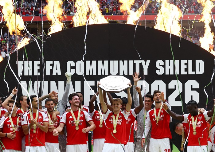 Soccer Football - FA Community Shield - Arsenal v Manchester City - Principality Stadium, Cardiff, Wales, Britain - August 16, 2026 Arsenals Martin Odegaard lifts the trophy as he celebrates with teammates after winning the FA Community Shield Actio