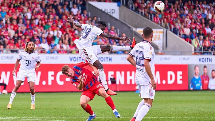HEIDENHEIM, GERMANY - AUGUST 18: Yannik Wagner of Heidenheim  battles for the ball with Bara Joseph Sapoko Ndiaye of Bayern Mnchen   during the preseason friendly match between 1. FC Heidenheim and FC Bayern Mnchen at Voith-Arena on August 18, 2026 i