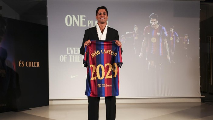 BARCELONA, SPAIN - AUGUST 20: Joao Cancelo poses in his shirt after signing his new contract as a new FC Barcelona player during his presentation at Commercial Office on August 20 2026 in Barcelona, Spain. (Photo By Javier Borrego/Europa Press via Ge