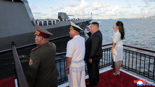 North Korean leader Kim Jong Un, accompanied by his daughter Kim Ju Ae, attends the commissioning ceremony of the destroyer 