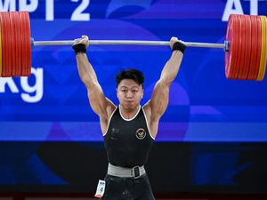 Raih Emas Asian Games, Lifter Rahmat Erwin Pecahkan Rekor Dunia