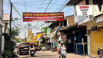 Beredar Spanduk Protes Warga Minta Rumah Pompa Ketintang Segera Tuntas