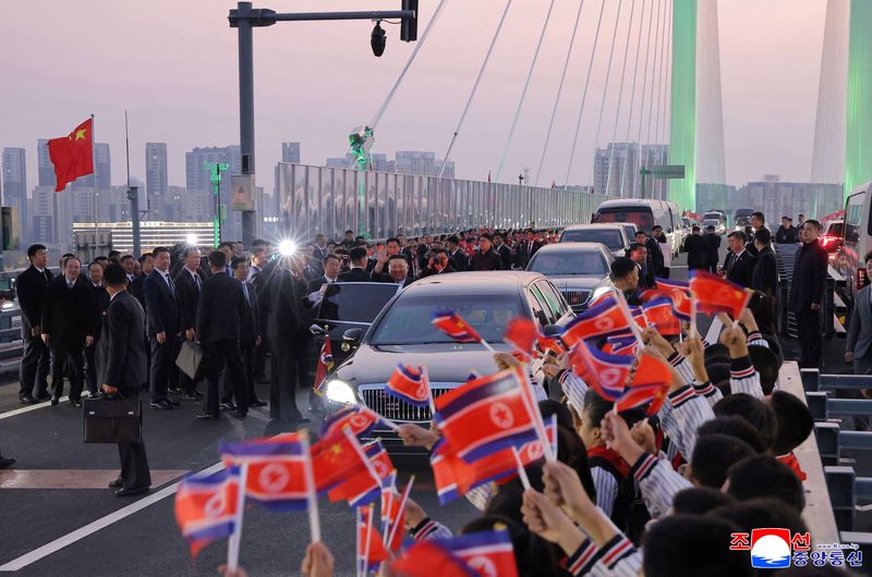 North Korean leader Kim Jong Un waves as he visits the New Yalu River Bridge linking Dandong, China, and Sinuiju, North Korea, during a trip to Dandong, Liaoning province, China, October 24, 2026, in this photo released by North Korea's Korean Central News Agency (KCNA). KCNA via REUTERS ATTENTION EDITORS - THIS IMAGE WAS PROVIDED BY A THIRD PARTY. REUTERS IS UNABLE TO INDEPENDENTLY VERIFY THIS IMAGE. NO THIRD PARTY SALES. SOUTH KOREA OUT. NO COMMERCIAL OR EDITORIAL SALES IN SOUTH KOREA.