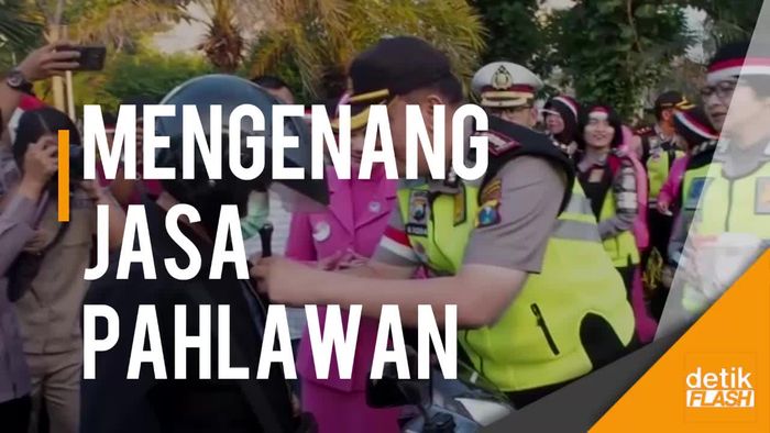 Polrestabes Surabaya Bagikan 1.000 Pin Merah-Putih ke Pengguna Jalan