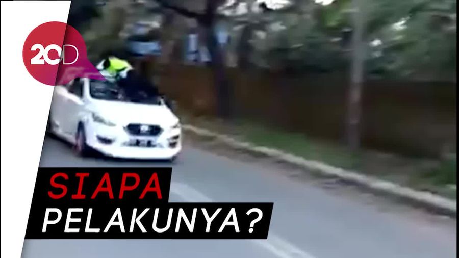 Video Polisi Nyangkut di Atap Mobil Usai Ditabrak