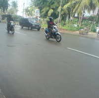 Genangan Air di Jl Yos Sudarso Sirna, Lalin Lancar