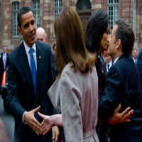 Tak Ada Cium Pipi Antara Obama dan Bruni