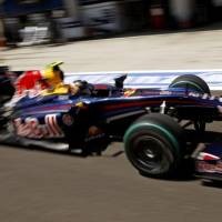 Vettel Kalahkan Button