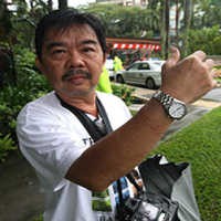 Ambil Foto Banjir Singapura, Fotografer Ditangkap