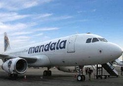 Mandala Airlines dan Indonesia Air Asia Turunkan Kelas Layanan