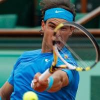 Nadal Melaju ke 8 Besar