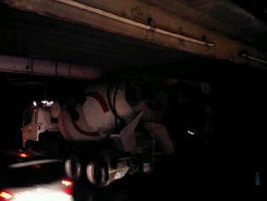 Truk Holcim Nyangkut di Kolong Rel Bintaro