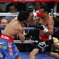 Menang Angka Atas Marquez, Pacman Pertahankan Gelar