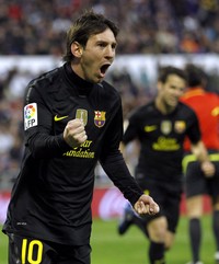Lionel Messi merayakan gol yang dicetaknya. Dalam pertandingan tersebut, Messi dua kali membobol gawang Real Zaragoza. Reuters/Albert Gea.