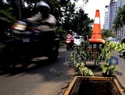 Teknik Menghadapi Jalan Berlubang 
