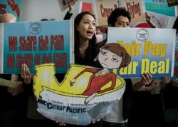 Nah Lho! Pramugari Cathay Pacific Ancam Mogok Senyum