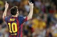 Messi merayakan golnya. REUTERS/Gustau Nacarino.