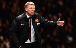 David Moyes memberikan arahan kepada para pemian MU. AFP/Andrew Yates.