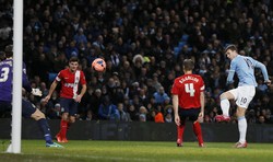 Edin Dzeko turut mencatatkan namanya di papan score setelah melesakkan bola pada menit 67' dan 79'. REUTERS/Darren Staples.