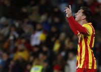 Dua gol yang dibuat Lionel Messi memberi The Catalans kemenangan 2-0 atas Getafe, yang juga memastikan diraihnya tiket ke perempatfinal. REUTERS/Sergio Perez.     