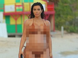 Sedang Hamil, Kim Kardashian Pamer Perut Buncit di Pantai Karibia