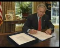 Bush Teken UU Bailout AS