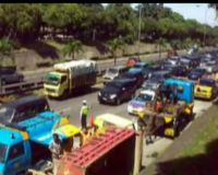 Truk Pasir Terguling di Tol
