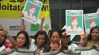 Diseret ke Pengadilan Hong Kong, Majikan Erwiana Tutupi Wajah dengan Koran