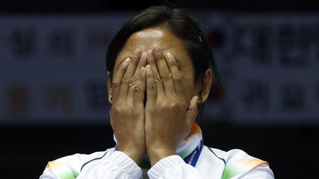 Petinju wanita India menolak medali perunggu yang diperolehnya di Asian Games 2014, dan meninggalkannya di podium.&nbsp;